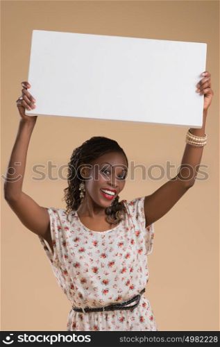 Portrait of cute african woman posing - holding blank copyspace sign