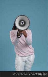 Portrait of cute african woman posing - speaking at megaphone