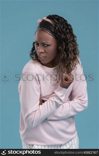 Portrait of cute african woman posing - threatening with fist gesture