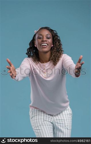 Portrait of cute african woman posing - welcoming gesture