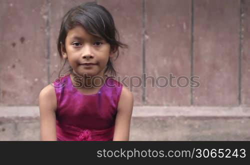 Portrait of cute Asian female child looking at camera. Copy space