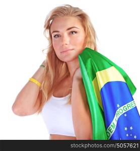Portrait of cute blond girl holding in hand Brazil national flag isolated on white background, serious fan of Brazilian football team