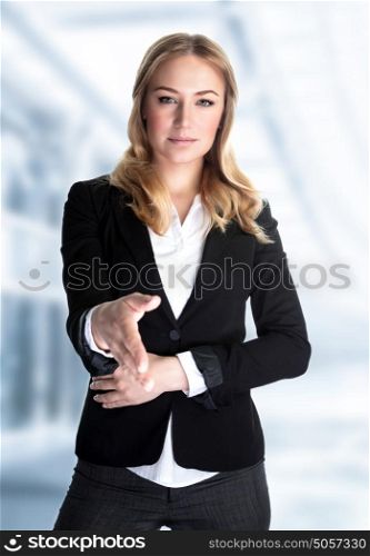 Portrait of cute blond girl stretches out her hand for a handshake, work in great financial company, young business professional make a deal