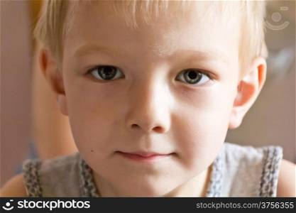 Portrait of cute boy with blond hair