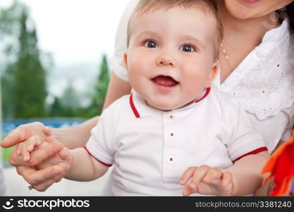 Portrait of cute child holding mother&rsquo;s hand