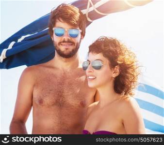 Portrait of cute couple spending sunny day on sailboat, enjoying beach holidays, luxury summer adventure, active lifestyle and vacation