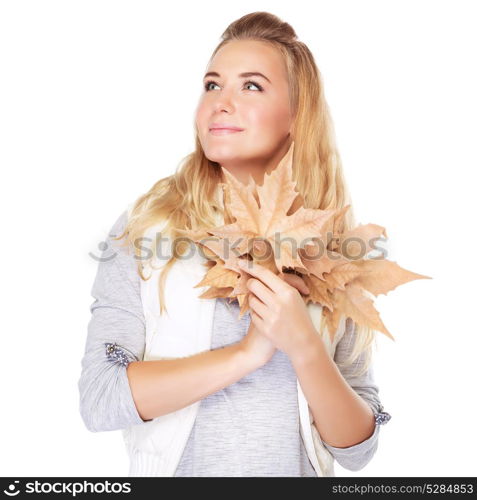 Portrait of cute dreamy girl with dry leaves bouquet in hands looking on a side, isolated on white background, autumn season