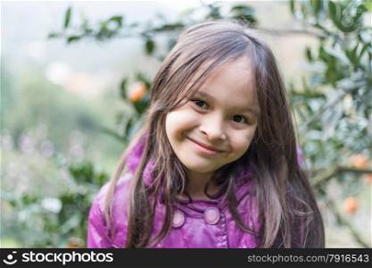 Portrait of cute girl at orange farm