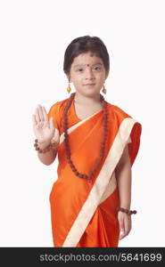 Portrait of cute girl dressed as Goddess Sita against white background