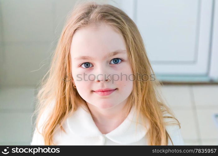 Portrait of cute girl with blond hair