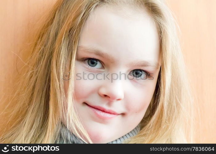 Portrait of cute girl with blond hair