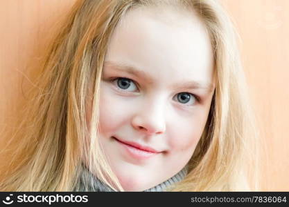 Portrait of cute girl with blond hair