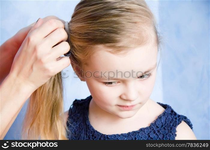 Portrait of cute girl with blond hair