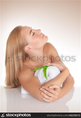 Portrait of cute girl with closed eyes enjoying day spa, studio shot, health care, beauty treatment, pleasure and enjoyment concept