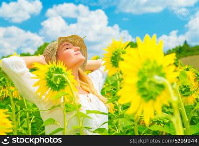 Portrait of cute girl with closed eyes enjoying sunny day and beautiful yellow sunflowers field, spending time in countryside, pleasure and freedom concept