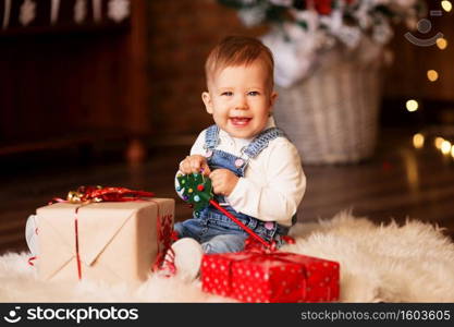 Portrait of cute little baby girl among Christmas decorations