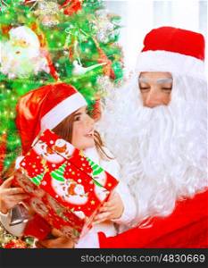 Portrait of cute little girl receives present from Santa Claus, sitting near decorated Christmas tree with beautiful wrapped gift box, happy winter holidays concept