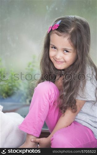 Portrait of cute little girl relaxing at home