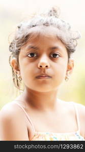 Portrait of cute little girl showing her beautiful face