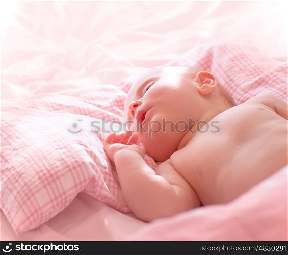 Portrait of cute little sleeping baby, sweet naked newborn girl napping at home, healthy lifestyle, innocence concept