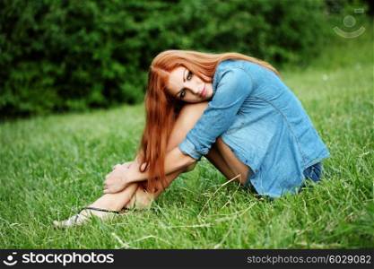 Portrait of cute red haired young woman, outdoors, lifestyle, legs care