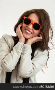 Portrait of cute woman wearing orange sunglasses