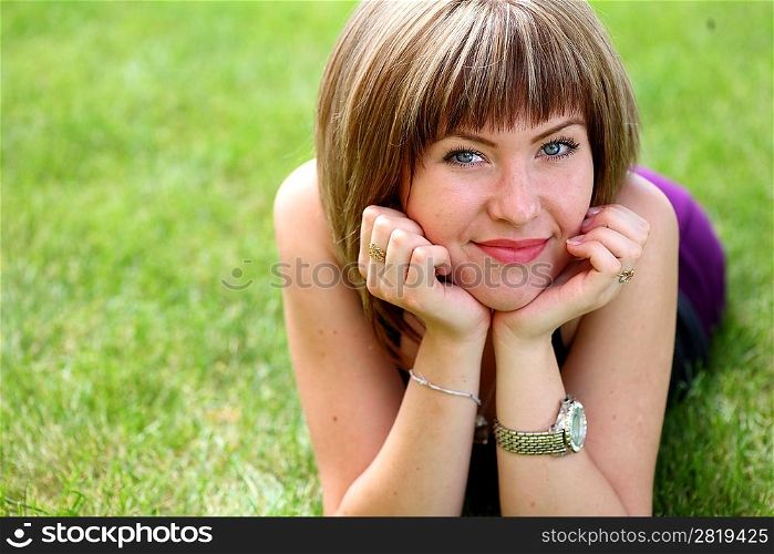 portrait of cute young teenage girl relaxing in spring park