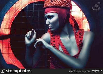 portrait of dark woman in red and light
