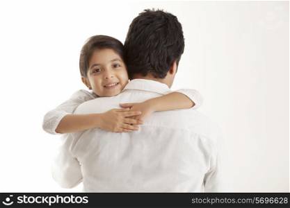 Portrait of daughter embracing father