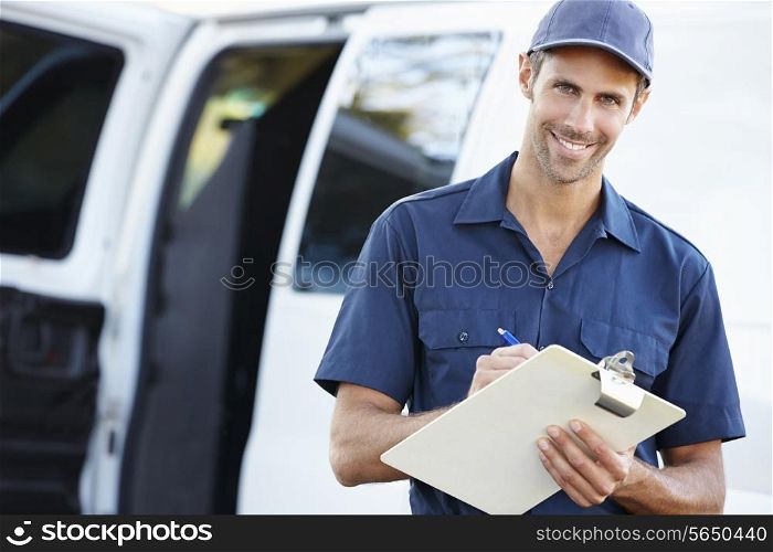 Portrait Of Delivery Driver With Clipboard