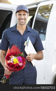 Portrait Of Delivery Driver With Flowers