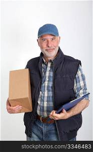 Portrait of delivery man holding package