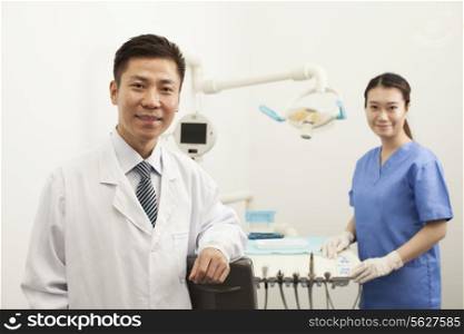 Portrait Of Dentist In Clinic