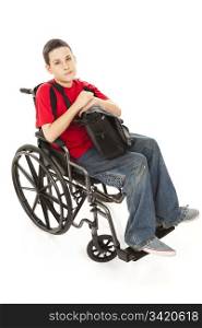 Portrait of disabled teen boy in his wheelchair. Full body isolated. Serious expression.