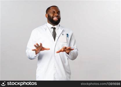 Portrait of disgusted handsome physician or male doctor, african american therapist, grimacing aversion, step back and raise hands in defense from something ugly and disgusting.. Portrait of disgusted handsome physician or male doctor, african american therapist, grimacing aversion, step back and raise hands in defense from something ugly and disgusting