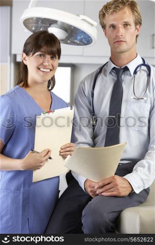 Portrait Of Doctor And Nurse In Doctor&#39;s Office