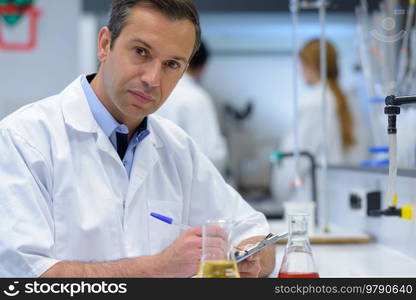 portrait of doctor documenting scientific experiment