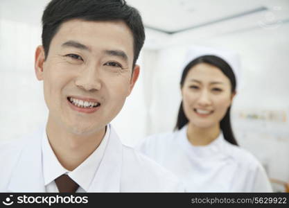 Portrait of Doctor, Nurse in Background