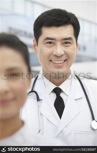 Portrait of Doctor, Nurse in Foreground