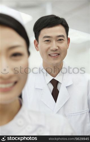 Portrait of Doctor, Nurse in foreground