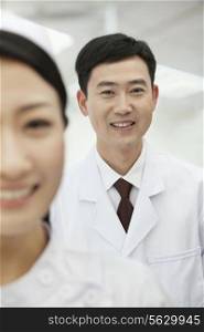 Portrait of Doctor, Nurse in foreground