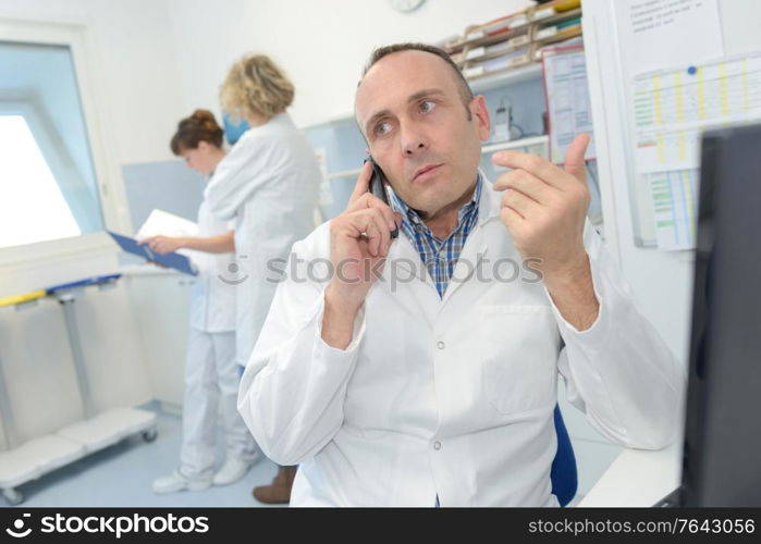 portrait of doctor on telephone