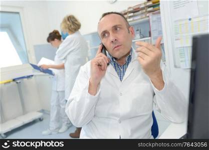 portrait of doctor on telephone