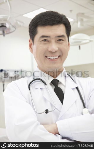 Portrait of Doctor Standing With Arms Crossed