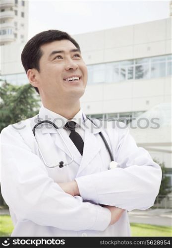 Portrait of Doctor Standing With Arms Crossed