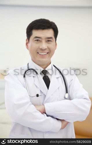 Portrait of Doctor Standing With Arms Crossed