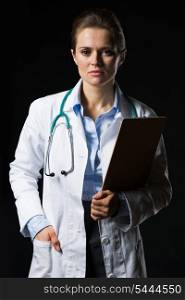 Portrait of doctor woman with clipboard isolated on black