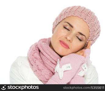 Portrait of dreaming woman in knit winter clothes
