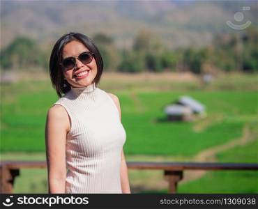 Portrait of eautiful lady at paddy field on a sunny day