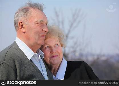 Portrait of elderly couple on spring sky